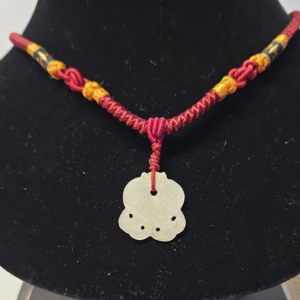 Red Braided Necklace with Carved Jade Pendant